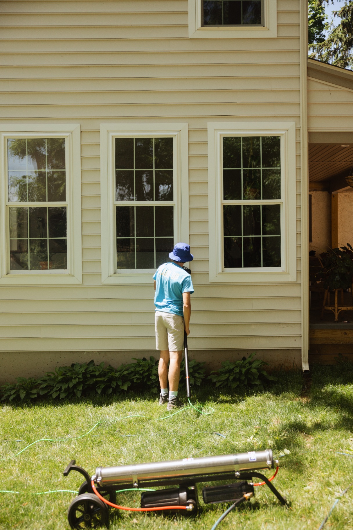 Heads Up crew working on a row of residential windows
